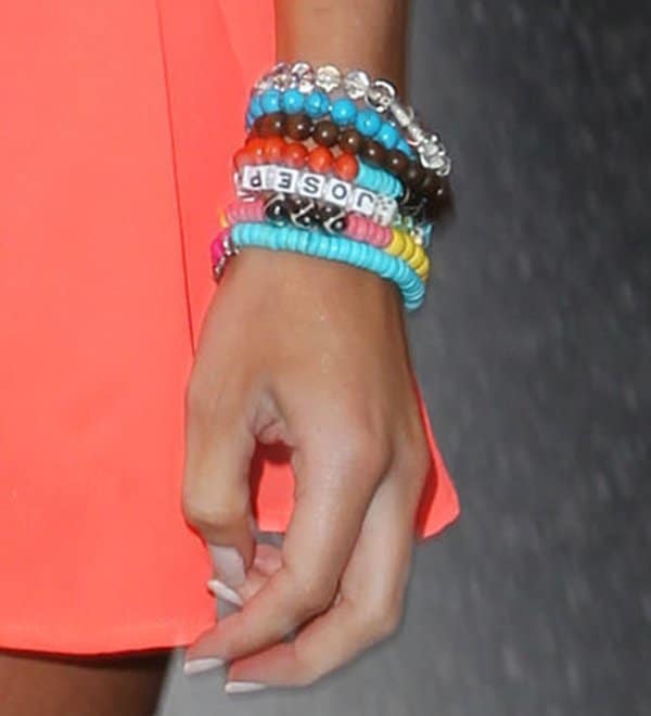Emily decorated her wrist with a nice stack of colorful bracelets of all kinds