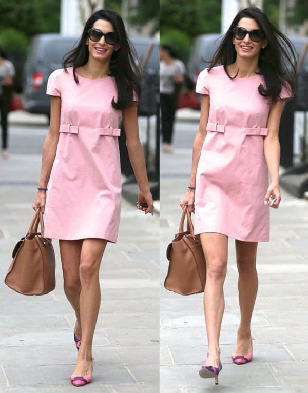 Amal Alamuddin flaunts her long legs in a pink dress while leaving her apartment