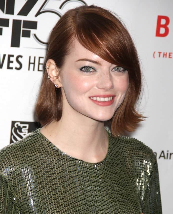 Emma Stone rocks her signature red hair with green hue eye makeup