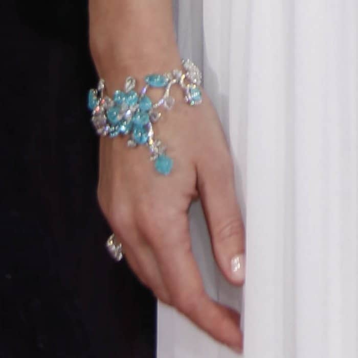 Emily Blunt shows off her turquoise bracelet from American bespoke designer Lorraine Schwartz