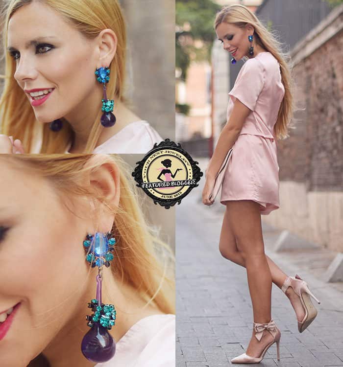 Martha shows off her colorful earrings in a feminine all-pink ensemble