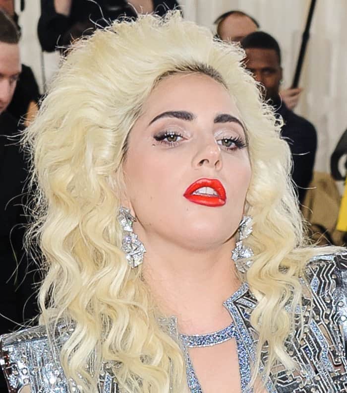 Lady Gaga rocked big hair and a circuit board Versace jacket with shoulder pads