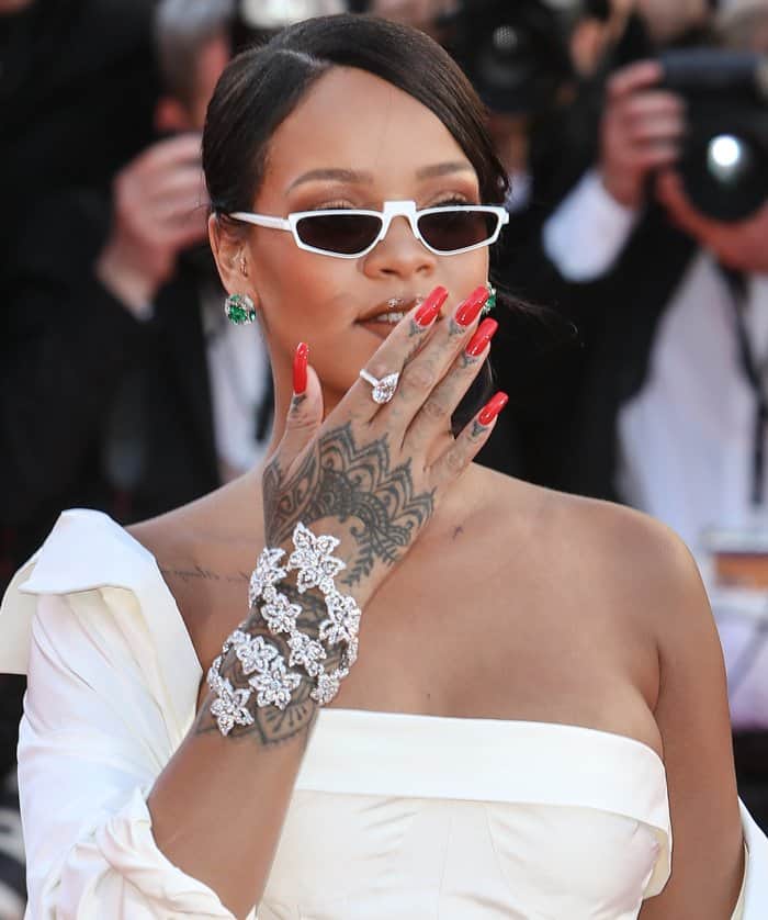 The singer blew a kiss to the public while showing off her sparkling wrist jewelry