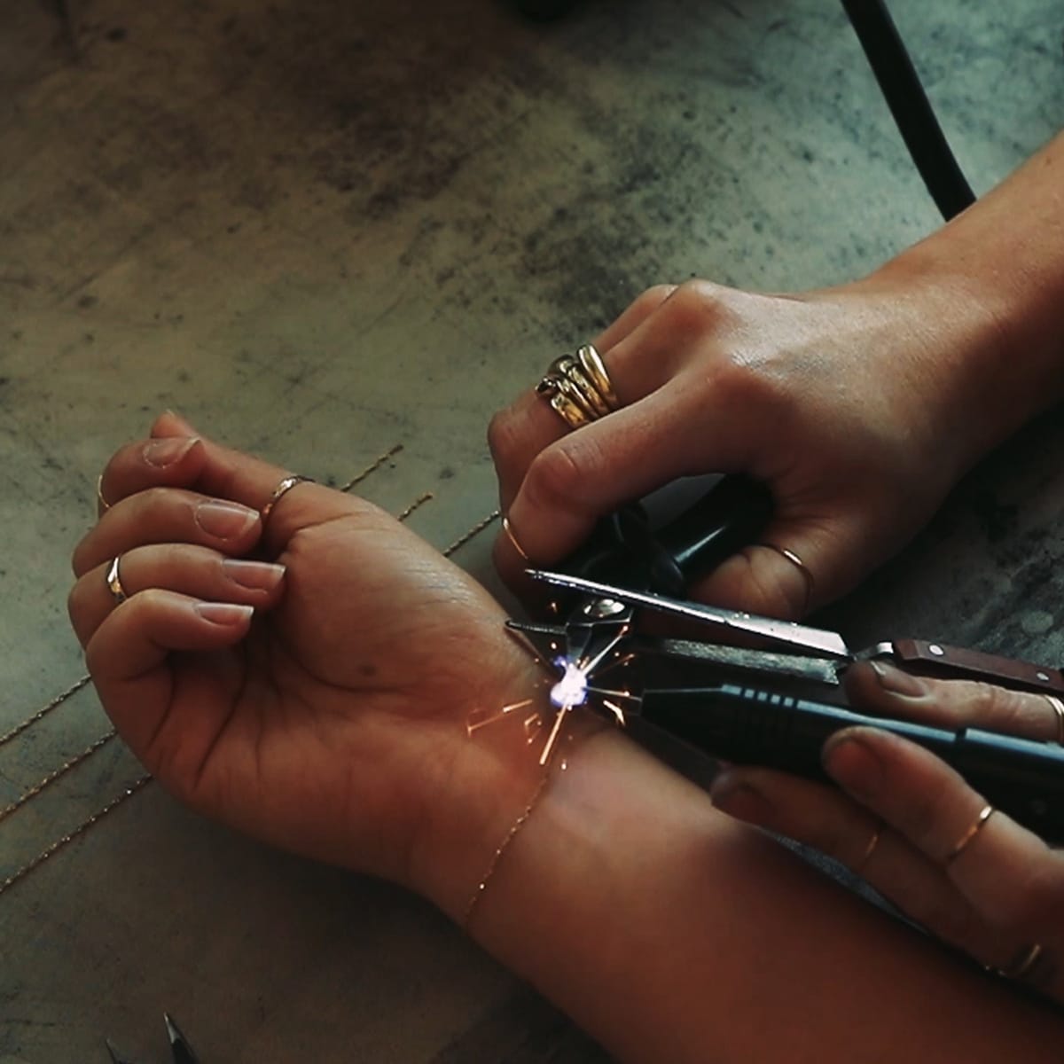 Permanent bracelets or necklaces have no clasps and are attached to the wearer by welding the chain